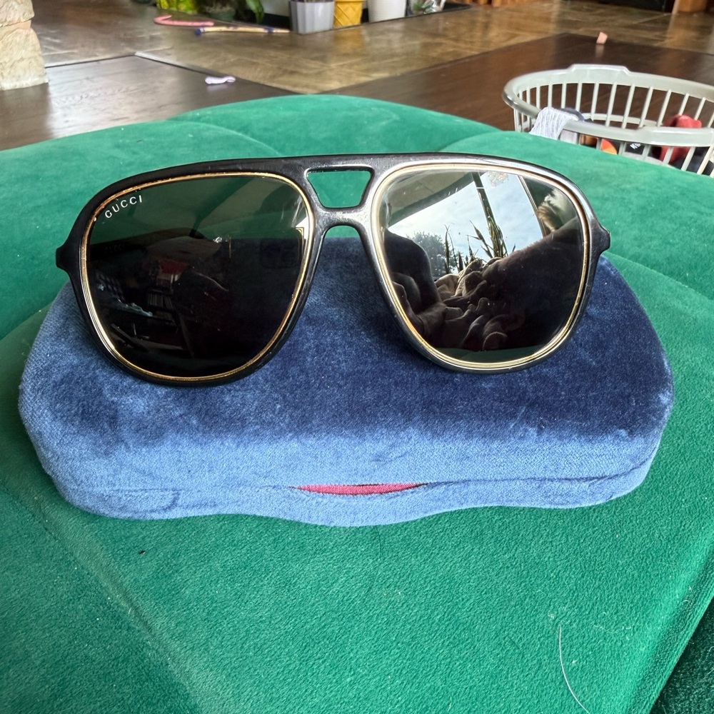 Gucci Black Frame Sunglasses with Gold Detail
